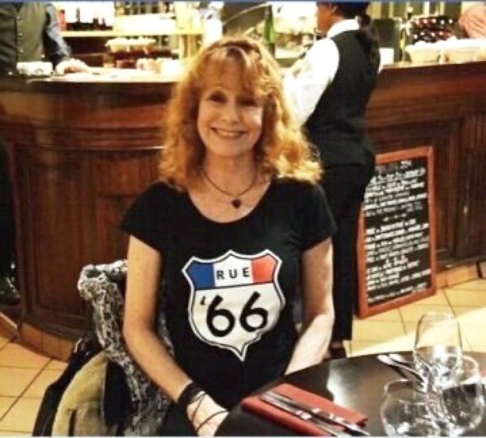 Rue '66 T-shirt held up, showing two mod figures with guitars and a bass drum